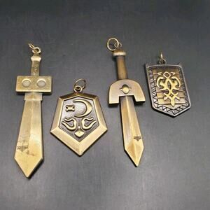 Legend of Zelda Skyward Sword Pendant Set Gold Tone Sword Shield Lot of 4